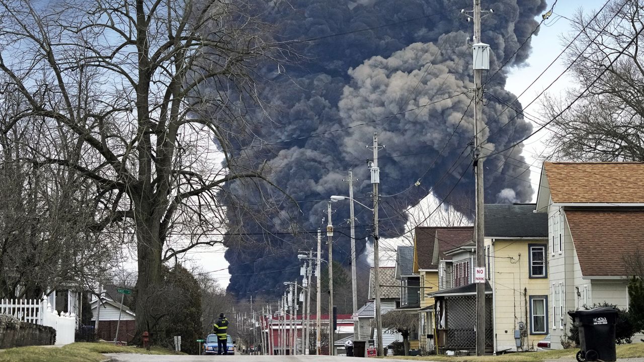 A black plume rises over East Palestine, Ohio, as a result of the controlled detonation of a portion of the derailed Norfolk Southern trains on Feb. 6, 2023. Staff and board members of the National Transportation Safety Board leveled harsh criticism of Norfolk Southern for recommending the controlled explosion at a hearing on the accident Tuesday.