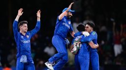 Afghanistan players celebrate after defeating Australia.