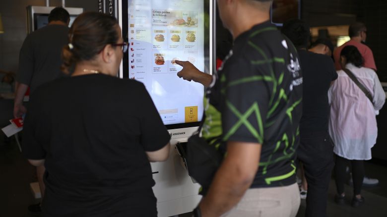 People order at a McDonald's kiosk on the day the fast food chain releases new '$5 Meal Deal' today in an attempt to bring back customers and increase sales as inflation continues to affect consumer spending, New York, NY, June 25, 2024.