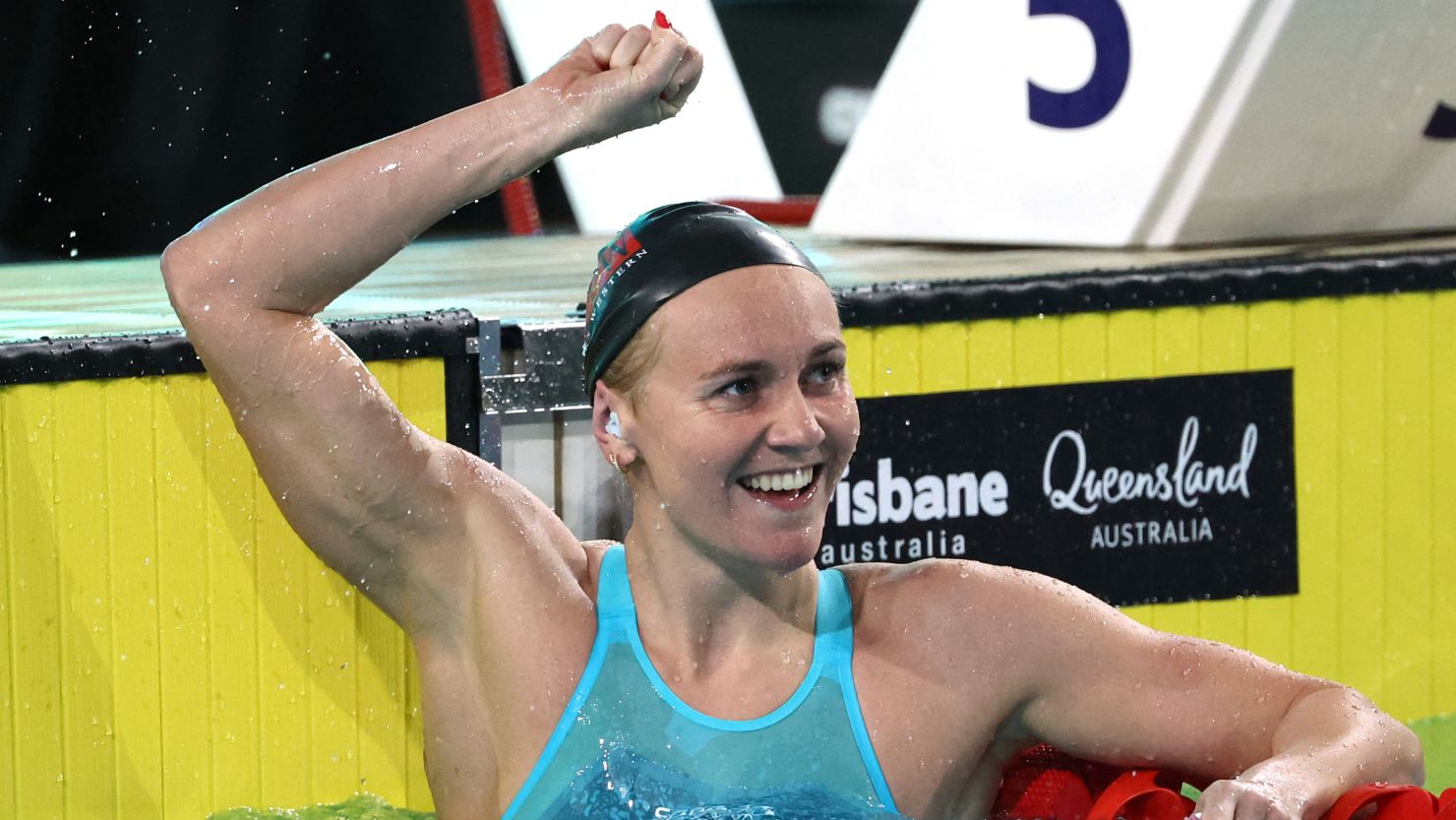 TOPSHOT - Australia's Ariarne Titmus reacts after winning the women's 200m freestyle final in a new world record time during the Australian Swimming Trials at the Brisbane Aquatic Centre on June 12, 2024. (Photo by DAVID GRAY / AFP) / -- IMAGE RESTRICTED TO EDITORIAL USE - STRICTLY NO COMMERCIAL USE -- (Photo by DAVID GRAY/AFP /AFP via Getty Images)
