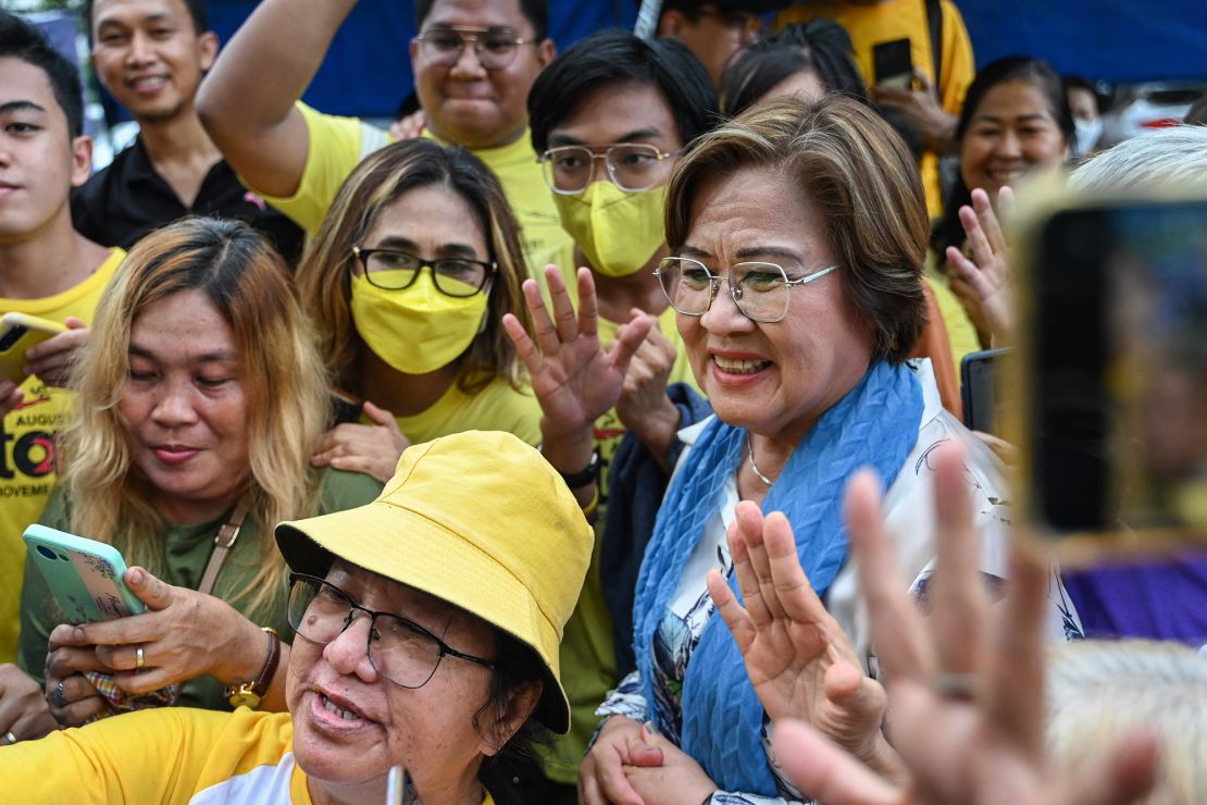 Former Philippine senator and human rights campaigner Leila de Lima with supporters after all remaining criminal charges against her were dropped on June 24, 2024.