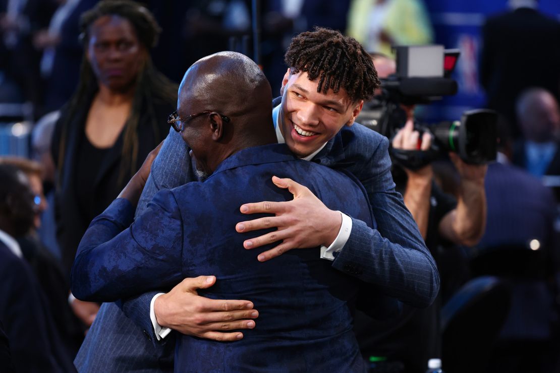 Tidjane Salaun celebrates after being drafted sixth overall by the Charlotte Hornets.