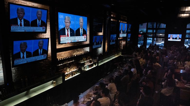 Guests at the Old Town Pour House watch the debate between President Joe Biden and presumptive Republican nominee former President Donald Trump on June 27, 2024 in Chicago, Illinois. The debate is the first of two scheduled between the two candidates before the November election.