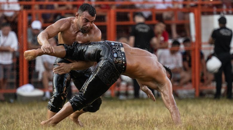 EDIRNE, TURKIYE - JULY 07: Turkish wrestlers Yusuf Can Zeybek (L) and Mustafa Tas (R) compete in the championship match of the chief wrestler during the 663rd Historical Kirkpinar Oil Wrestling in Edirne, Turkiye on July 07, 2024. (Photo by Cem Tekkesinoglu/Anadolu via Getty Images)