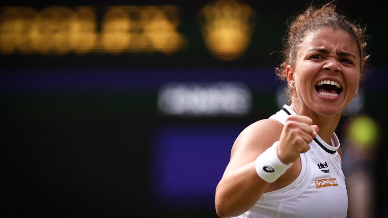 Italy's Jasmine Paolini celebrates winning a point in the third set against Croatia's Donna Vekic during their women's singles semi-final tennis match on the eleventh day of the 2024 Wimbledon Championships at The All England Lawn Tennis and Croquet Club in Wimbledon, southwest London, on July 11, 2024. (Photo by HENRY NICHOLLS / AFP) / RESTRICTED TO EDITORIAL USE (Photo by HENRY NICHOLLS/AFP via Getty Images)