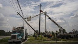 CenterPoint foreign assistance crews work to restore power lines on July 11, 2024 in Houston, Texas. Nearly one million people still remain without electricity in the wake of Hurricane Beryl, which was a category one hurricane that made a direct hit on Houston and surrounding areas on July 8, leaving more than two million people without power.