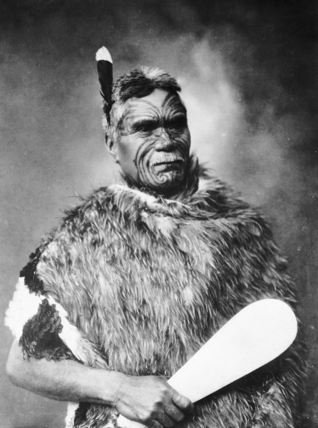 A Maori chief wears a huia feather in his hair