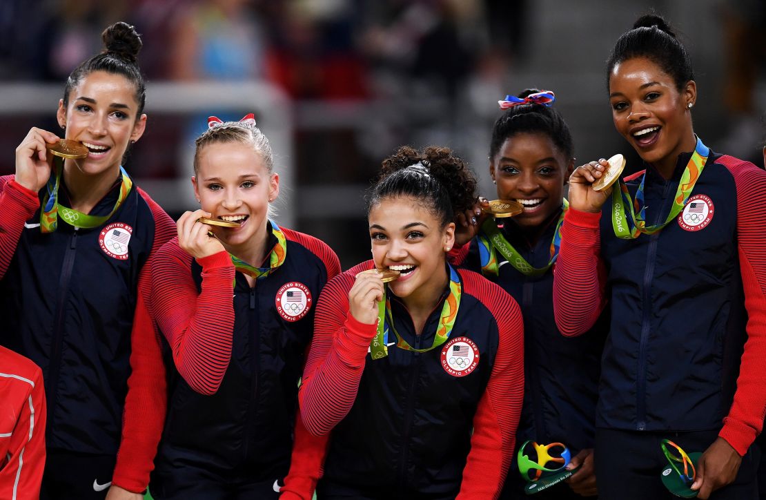 Gabby Douglas and the other old gold medal winning members of the US women's gymnastics team at the 2016 Rio Olympics — Alexandra Raisman, Madison Kocian, Lauren Hernandez and Simone Biles.