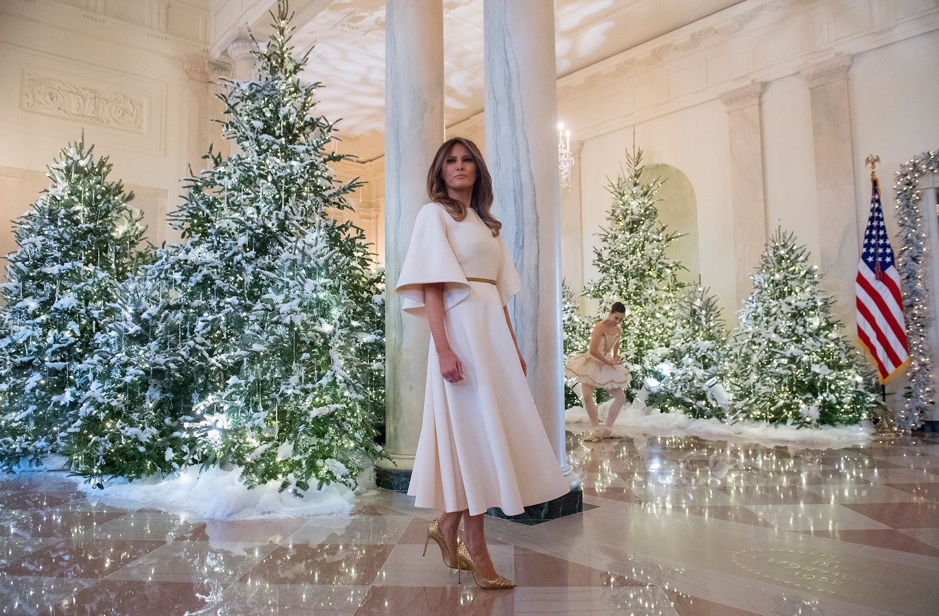 <strong>2017:</strong> Melania Trump in the Grand Foyer during a preview of the holiday decorations, which featured a ballet performance.