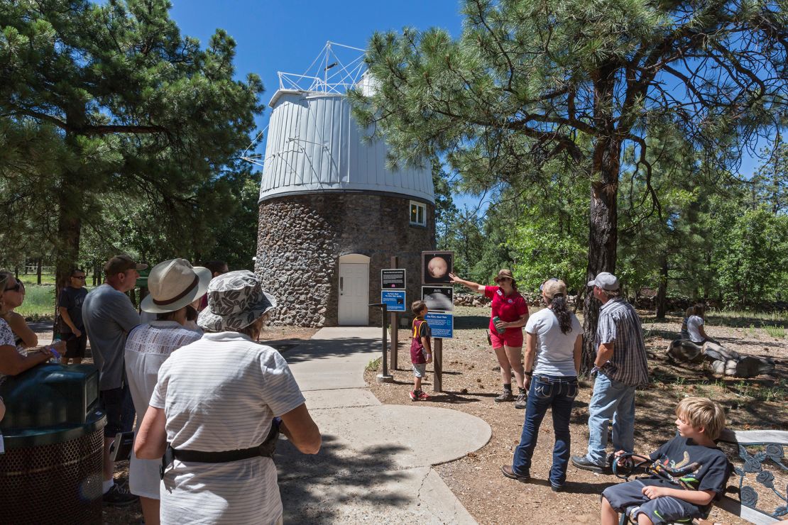 A guide tells visitors to the Lowell Observatory about the Pluto Discovery Dome. Pluto was discovered at the observatory on February 18, 1930.