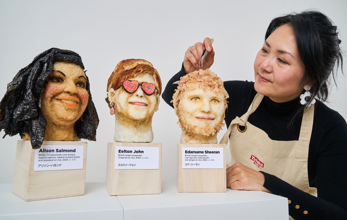 Wibowo puts the finishing touches to Sheeran, whose pun-y likeness is pictured alongside "Eelton" John and British TV host Alison "Salmond" Hammond.