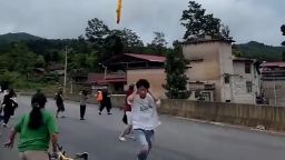 A screengrab taken from video shows suspected Chinese rocket debris falling over Xianqiao Village, Xinba Town, Guizhou Province, China, following a launch.