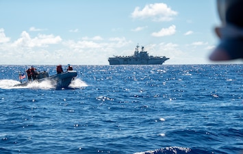 Sailors from USS America (LHA 6) participate in small boat operations in the Philippine Sea.