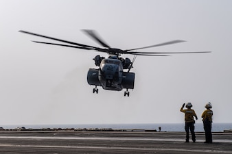 An MH-53E Sea Dragon helicopter from HM-15 lands aboard USS Theodore Roosevelt (CVN 71) during flight operations in the U.S. 5th Flee area of operations.