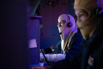 OS2 Edgar Robles monitors surface contacts in the combat information center aboard USS Somerset (LPD 25) during a general quarters drill in the Pacific Ocean.