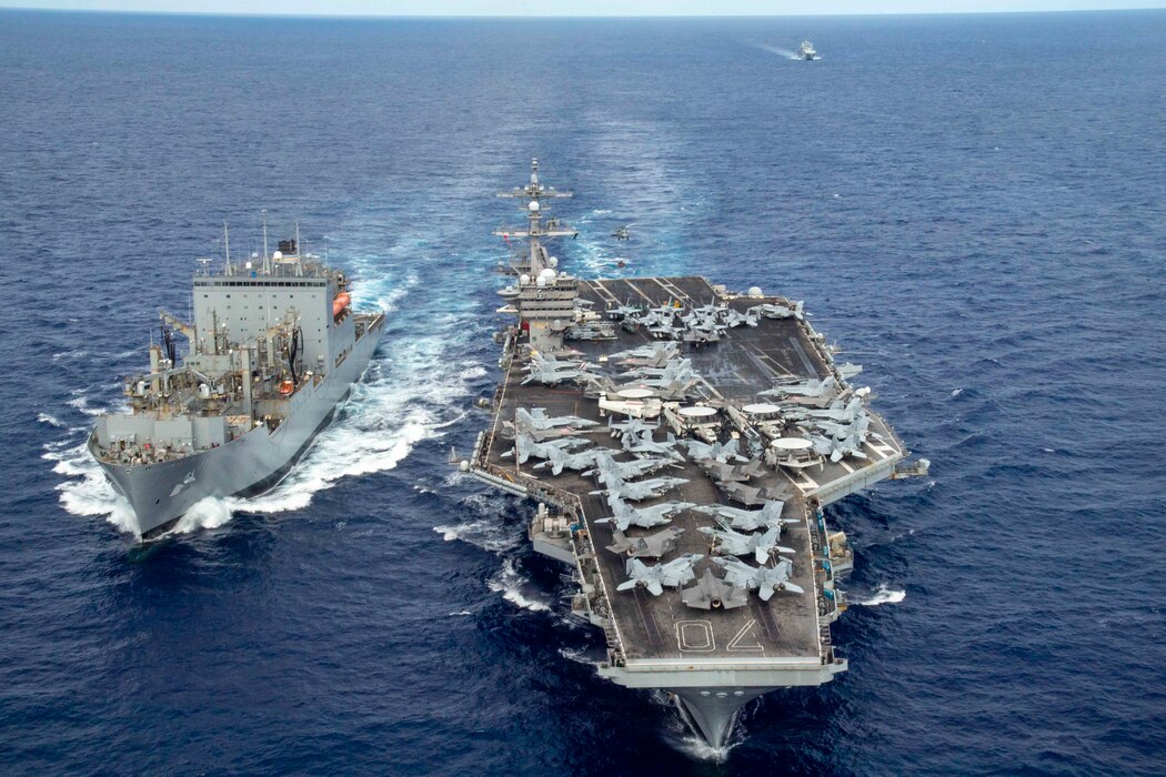 USS Carl Vinson (CVN 70) conducts a replenishment-at-sea with USNS Washington Chambers (T-AKE 11) during RIMPAC.