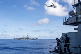 ITS Cavour (CVH 550), left, is underway with USS Abraham Lincoln (CVN 72) during the first-ever U.S. Navy and Italian navy bilateral multi-large deck event in the Indo-Pacific.