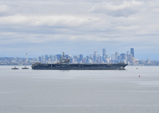 USS Ronald Reagan (CVN 76) transits Puget Sound towards its new homeport at Naval Base Kitsap, Washington.