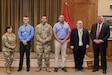 Brig. Gen. Laura McHugh, left, deputy adjutant general-Army, Pennsylvania National Guard, and retired Col. Richard Spiegel, right, of the Army Public Affairs Association, pose with members of the Pennsylvania National Guard state public affairs office after presenting them with the U.S. Army Keith L. Ware Public Affairs Organization of the Year award and Order of Saint Gabriel medallions during a ceremony Aug. 20, 2024, at Fort Indiantown Gap, Pennsylvania. (U.S. Army National Guard photo by Spc. Jessica Barb)