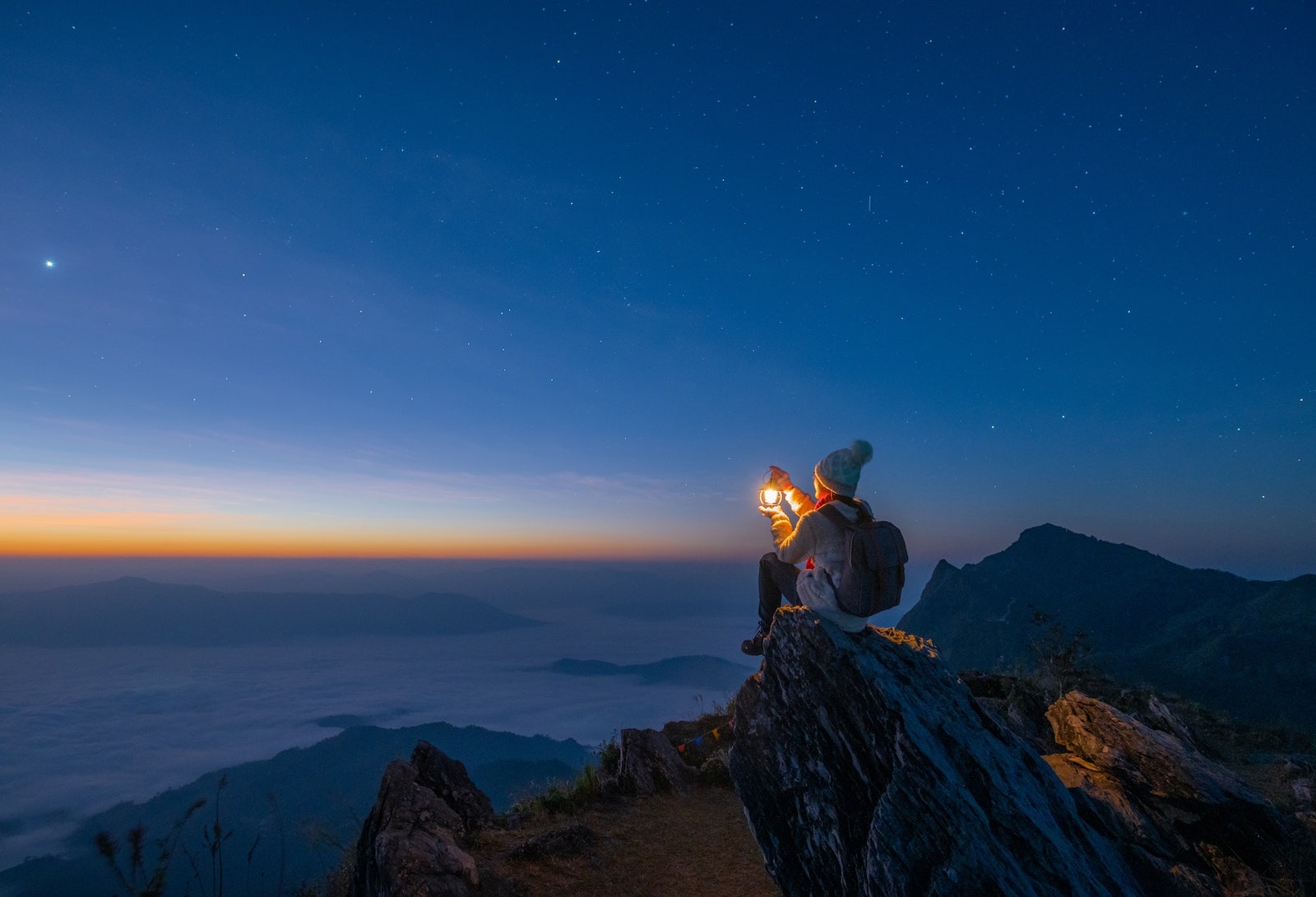 Conceptual shot of tourist woman while travel and adventure on mountains.