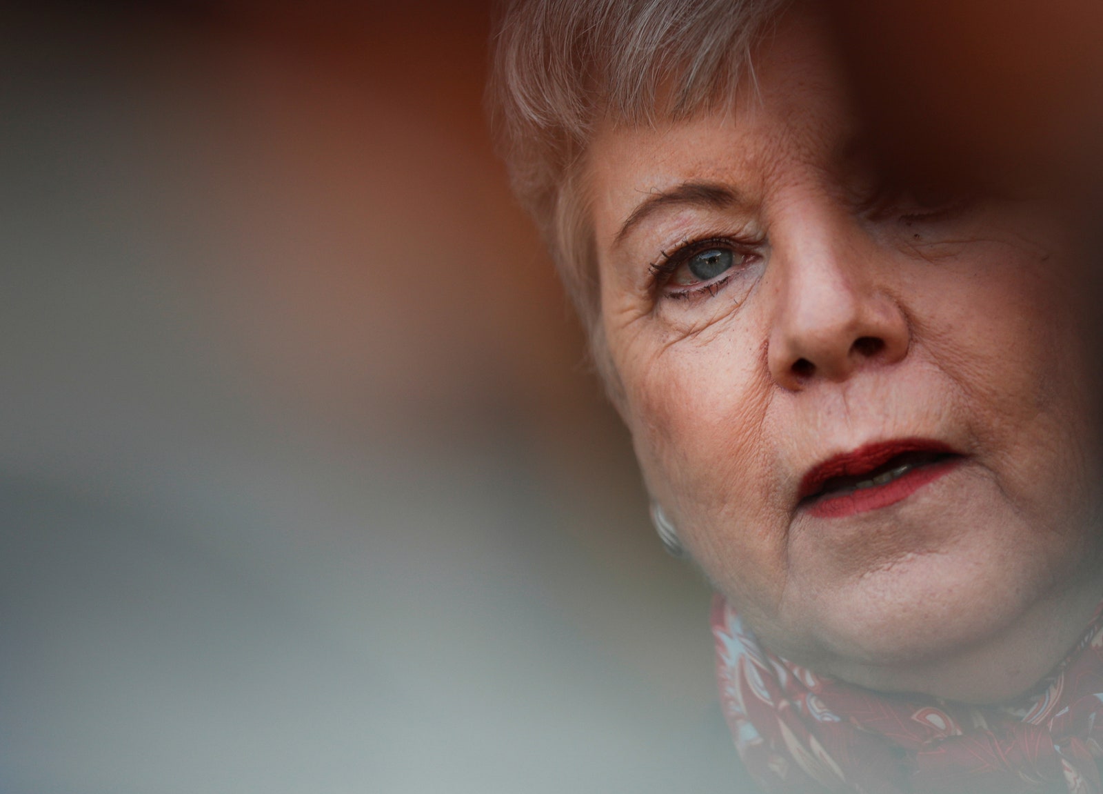 A close up of a woman's partially obscured face.