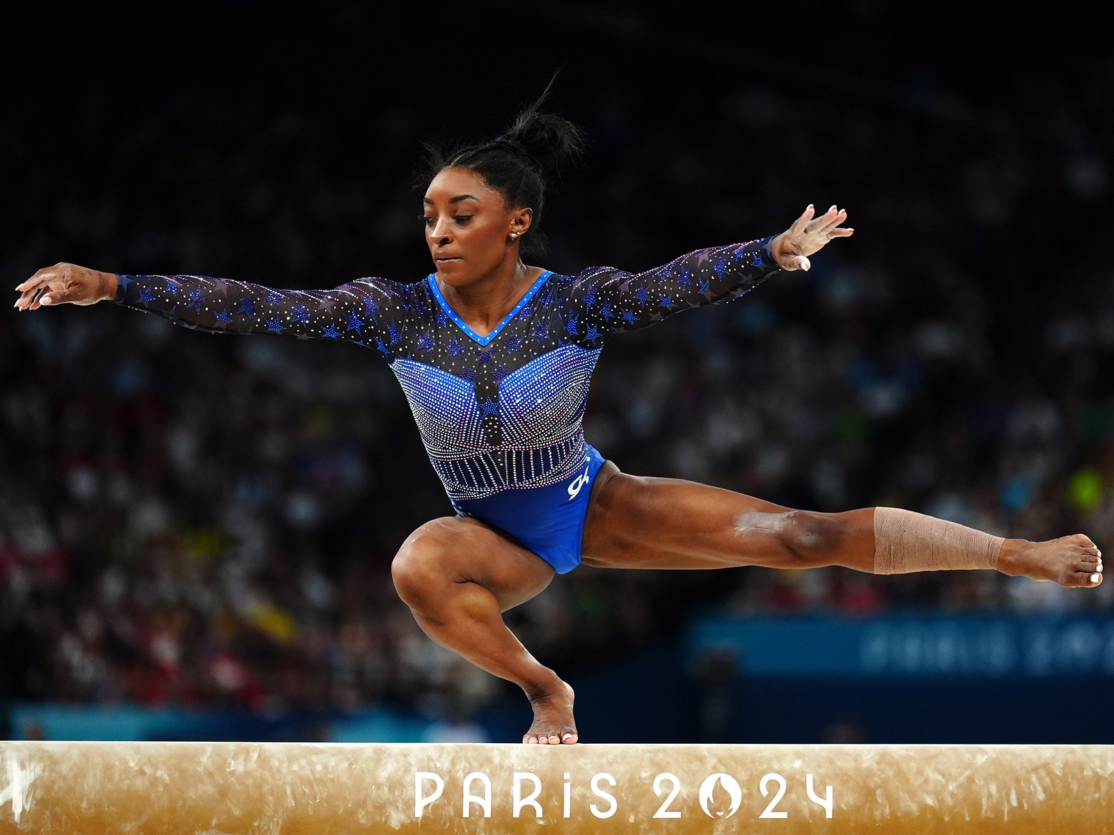 Simone Biles on balance beam at the 2024 Paris Olympic Games.