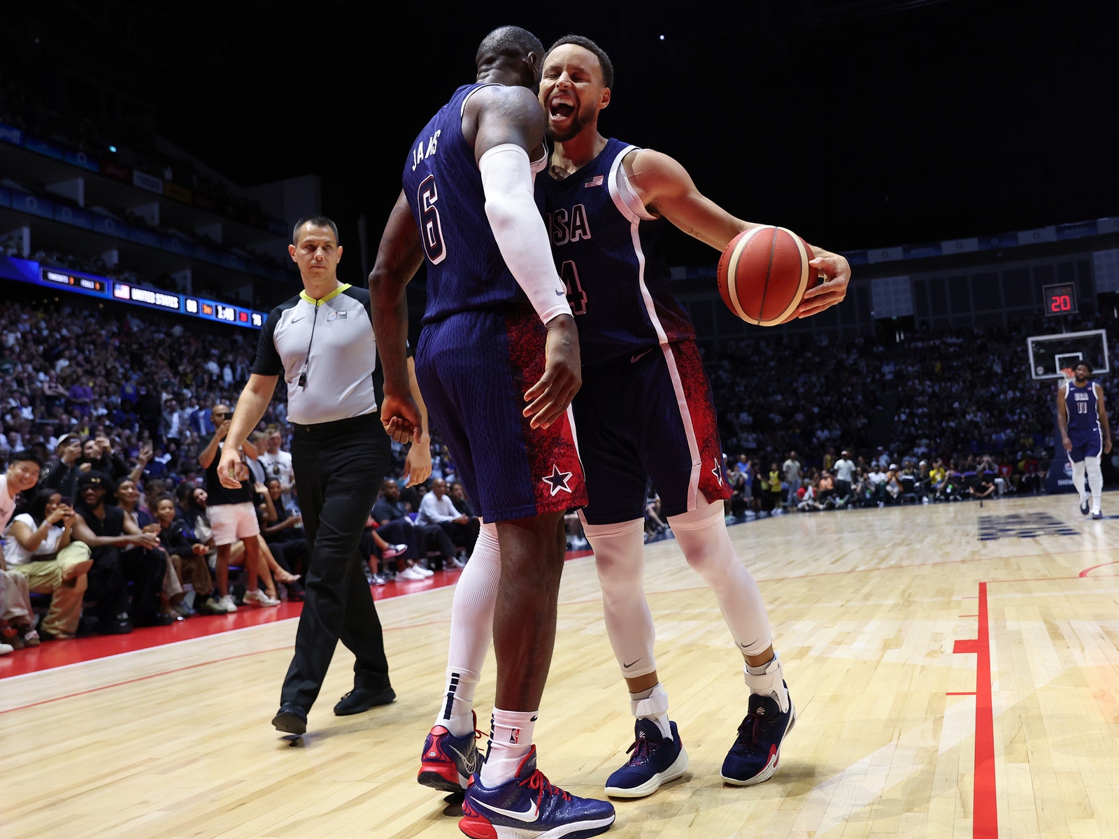 A photo of LeBron James and Stephen Curry of Team U.S.A. celebrating during the game against South Sudan at the 2024...