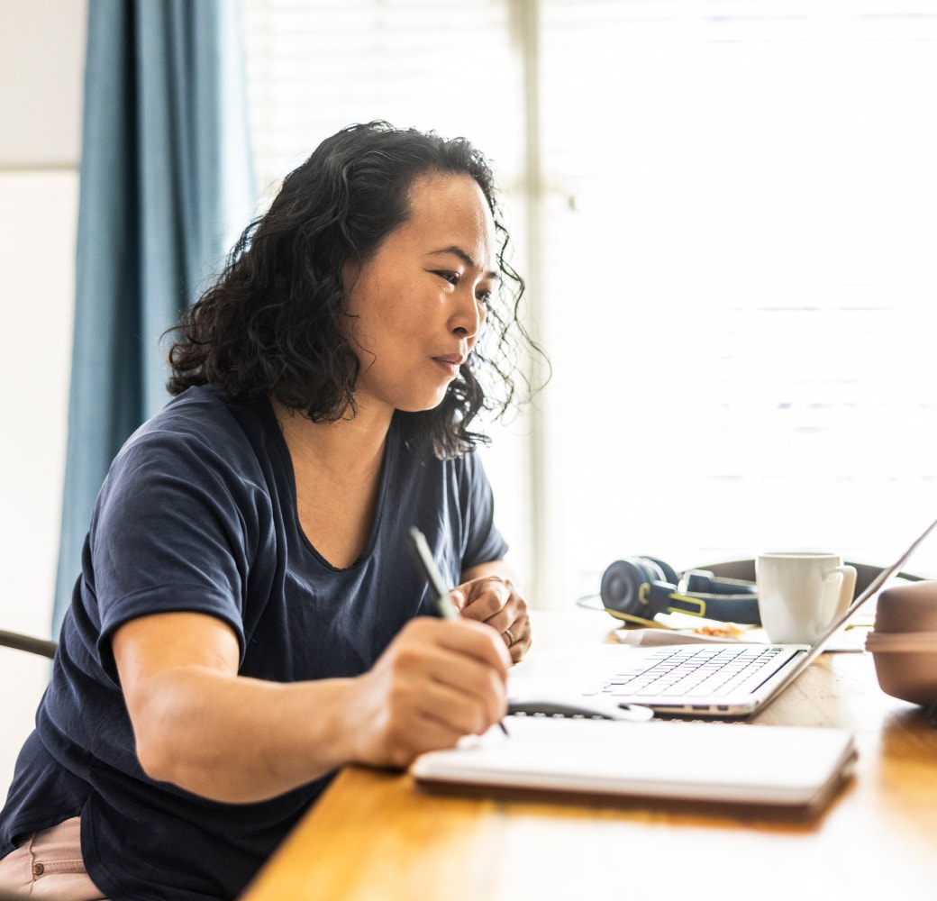 Asian woman at conference table