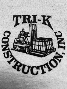 a black and white image of a forklift and the words trik construction