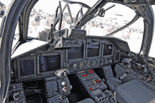 a cockpit of a military plane with a red button that says emergency exit