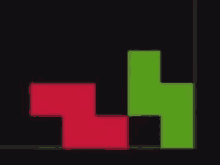 a red and green tetris block on a black background