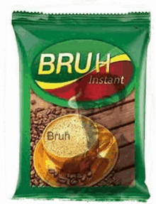 a bag of bruh instant coffee with a cup of coffee on a saucer on a table .