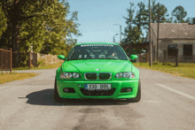 a green bmw with 330 bbl on the license plate