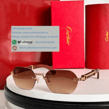 a pair of cartier sunglasses sitting on top of a white table