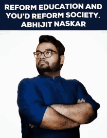 a man with his arms crossed in front of a sign that says reform education and you 'd reform society abhijit naskar