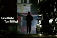 a silhouette of a man walking down a street with the words kaise mujhte tum mil gayi