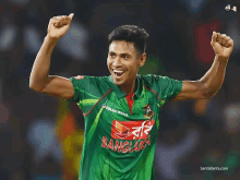 a man wearing a green bangladesh jersey celebrates