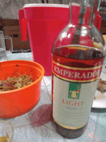 a bottle of emperado brandy sits on a table