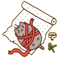 a cat is wrapped in a red ribbon on a roll of paper