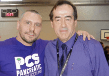 a man wearing a purple shirt that says pcs pancreatic scotland