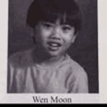 a black and white photo of a young boy with the name wen moon on the bottom .