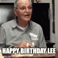 an elderly man is sitting in front of a birthday cake with candles and says `` happy birthday lee '' .