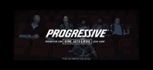 a group of people are sitting in a theater watching a movie sponsored by progressive.com