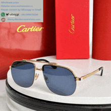 a pair of cartier sunglasses sits on a table