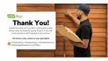 a man is holding an envelope in front of a sign that says css buy thank you