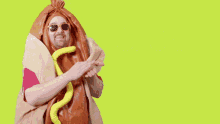 a man in a hot dog costume with the words cash that check below him