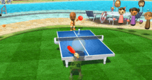 a ping pong game is being played by a man wearing a green shirt