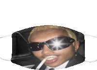 a man wearing sunglasses is smoking a cigarette while wearing a face mask .