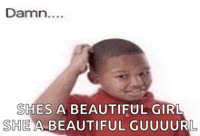 a young boy in a red shirt is scratching his head with the caption she 's a beautiful girl