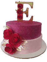 a pink cake with a letter e on top of it